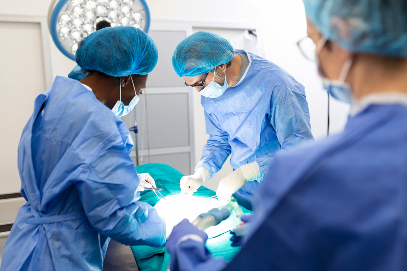 Surgeons team performs operation patient